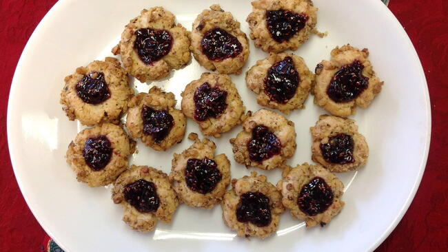plate of raspberry thumbprint cookies