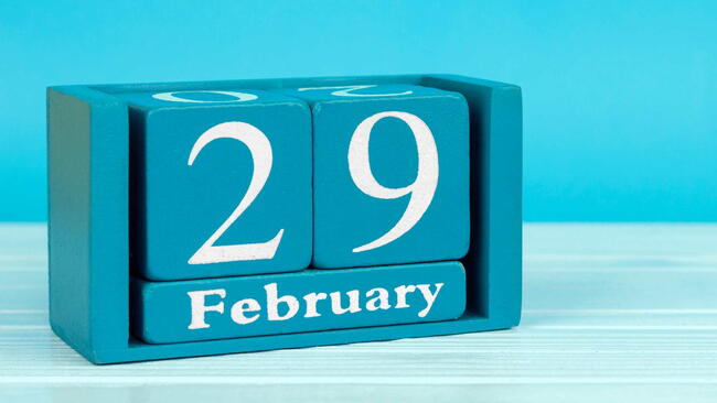 wooden calendar with the date of February 29 on a blue wooden background. leap day. leap year.